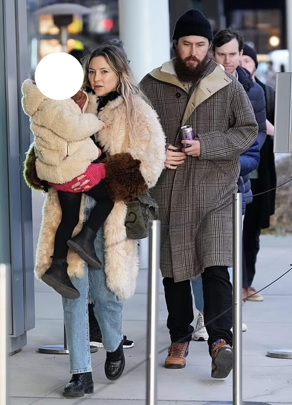 Kate Hudson wore a furry white coat while taking her daughter to the Whitney Museum in New York City with her boyfriend Danny Fujikawa.