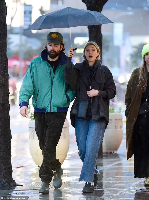 Elizabeth Olsen and Husband Robbie Arnett Brave Rainy LA with Umbrella on Lunch Date