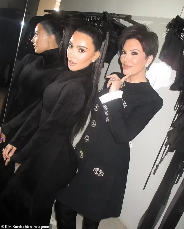 Kim Kardashian and her mom Kris Jenner twinned in matching black outfits, posing together for a photo