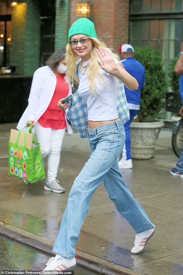Gigi Hadid’s Effortlessly Chic NYC Stroll: Beanie, Crop Top, and Low-Rise Jeans on Aug, 10, 2023