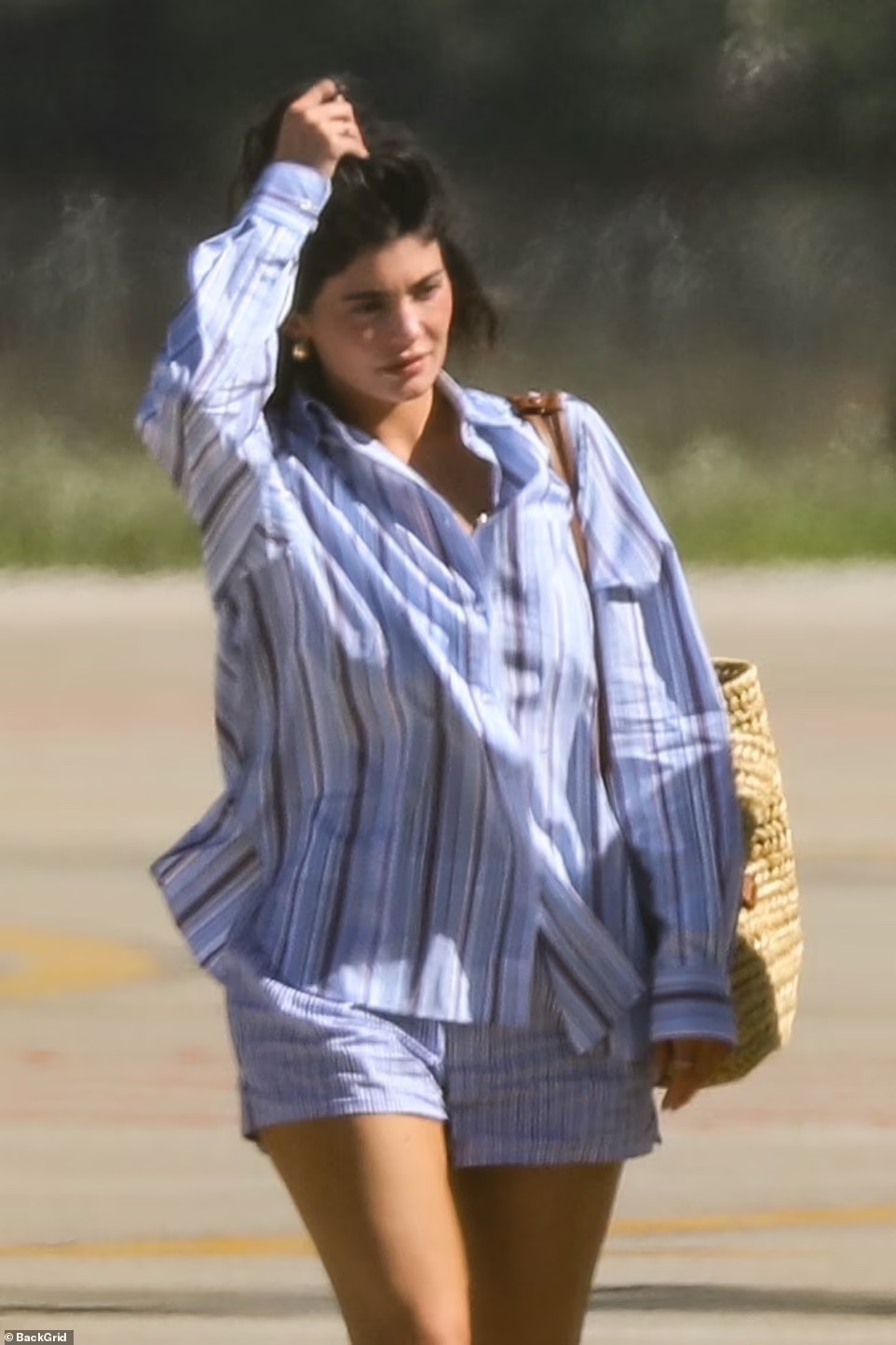 Kylie Jenner Radiates Summer Style in Striped Button-Up Shirt During Perugia Getaway on Aug 15, 2023