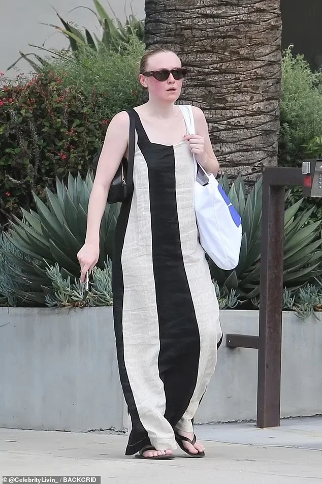 Dakota Fanning’s Hollywood Shopping Stroll: Striped Maxi Dress and Flip-Flops on Sep 18, 2023