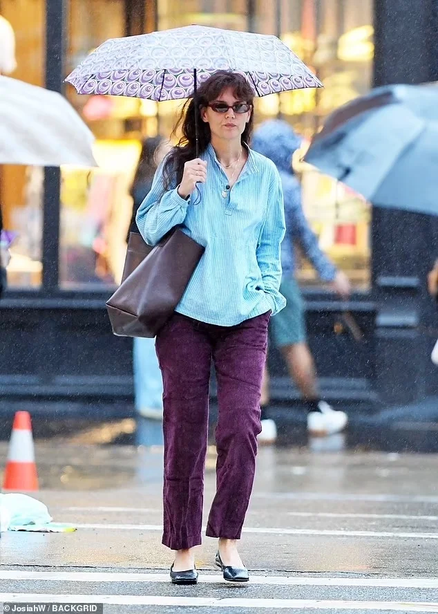 Katie Holmes’ Colorful Rainy Day Chic in NYC: Coffee Shop Pit Stop on Sep 18, 2023