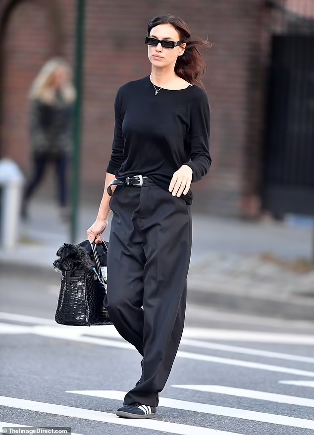 Edgy All-Black NYC Street Style: Irina Shayk and Her Pup on the Go on Oct 16, 2023