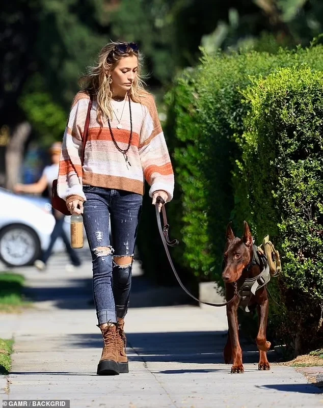 Paris Jackson’s Autumn Adventure: Striped Sweater & Distressed Denim Chic in West Hollywood on Oct 24, 2023