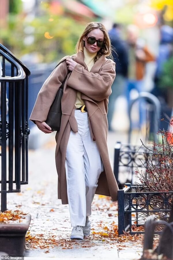 Jennifer Lawrence Steps Out in Cozy Brown Trench Coat Amidst NYC Adventures on Nov 22, 2023