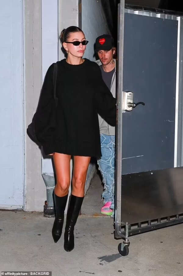 Hailey Bieber’s Stunning Black Sweater Dress and Boots Enroute to Church with Justin Bieber in LA on Nov 29, 2023