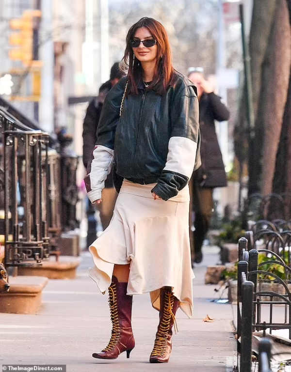 Emily Ratajkowski’s Chic NYC Stroll: Leather Bomber Jacket and Asymmetrical Skirt on Feb 19, 2024