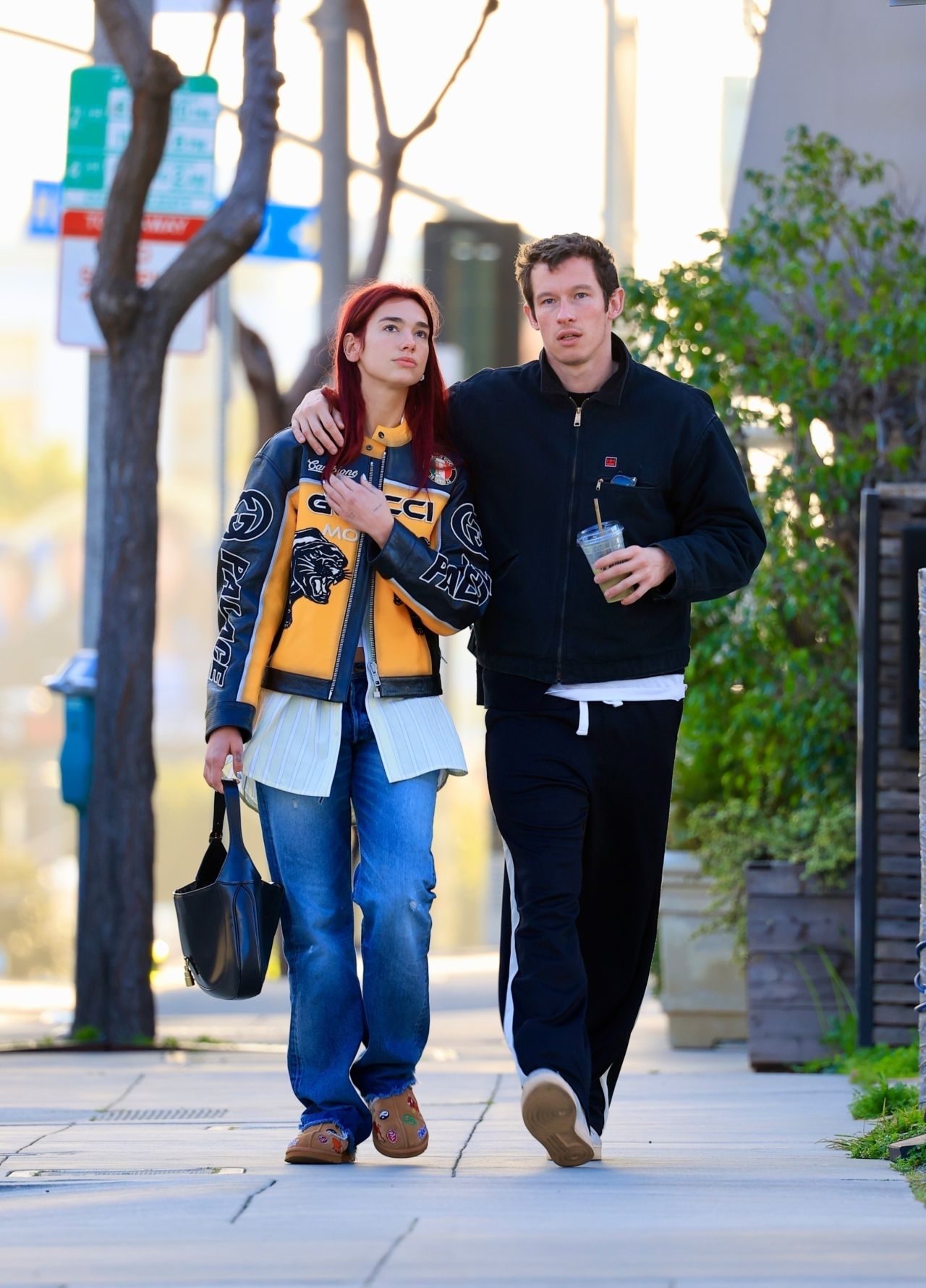 Where can I find affordable alternatives to the designer pieces worn by Dua Lipa and Callum Turner for their breakfast outing?