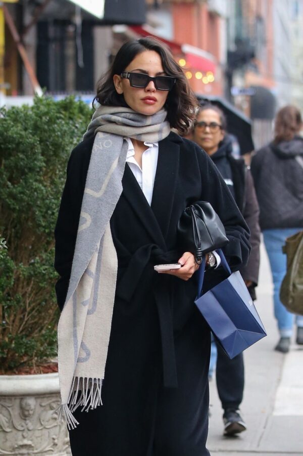 Exploring Eiza Gonzalez’s chic and elegant ensemble for a rainy day stroll in NYC on March 27, 2024