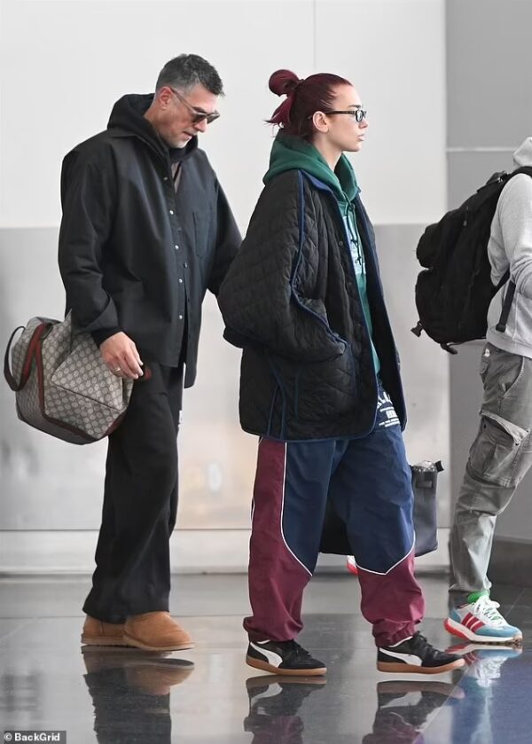 Dua Lipa’s Casual Arrival in NYC with Her Father: Airport Fashion Done Right on April 22, 2024