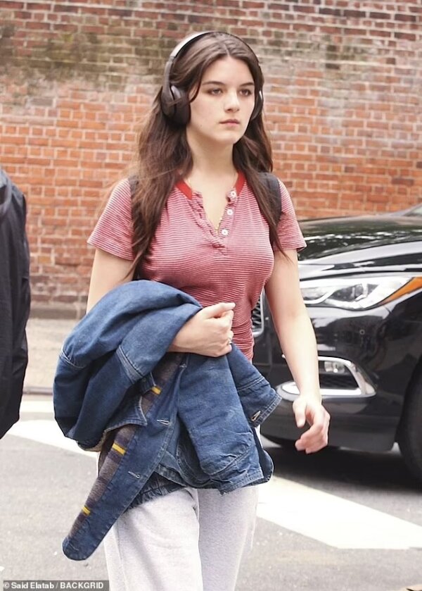 Exploring Suri Cruise’s City Style: A Look at Her Red and White Striped Top and Navy Backpack on May 15, 2024